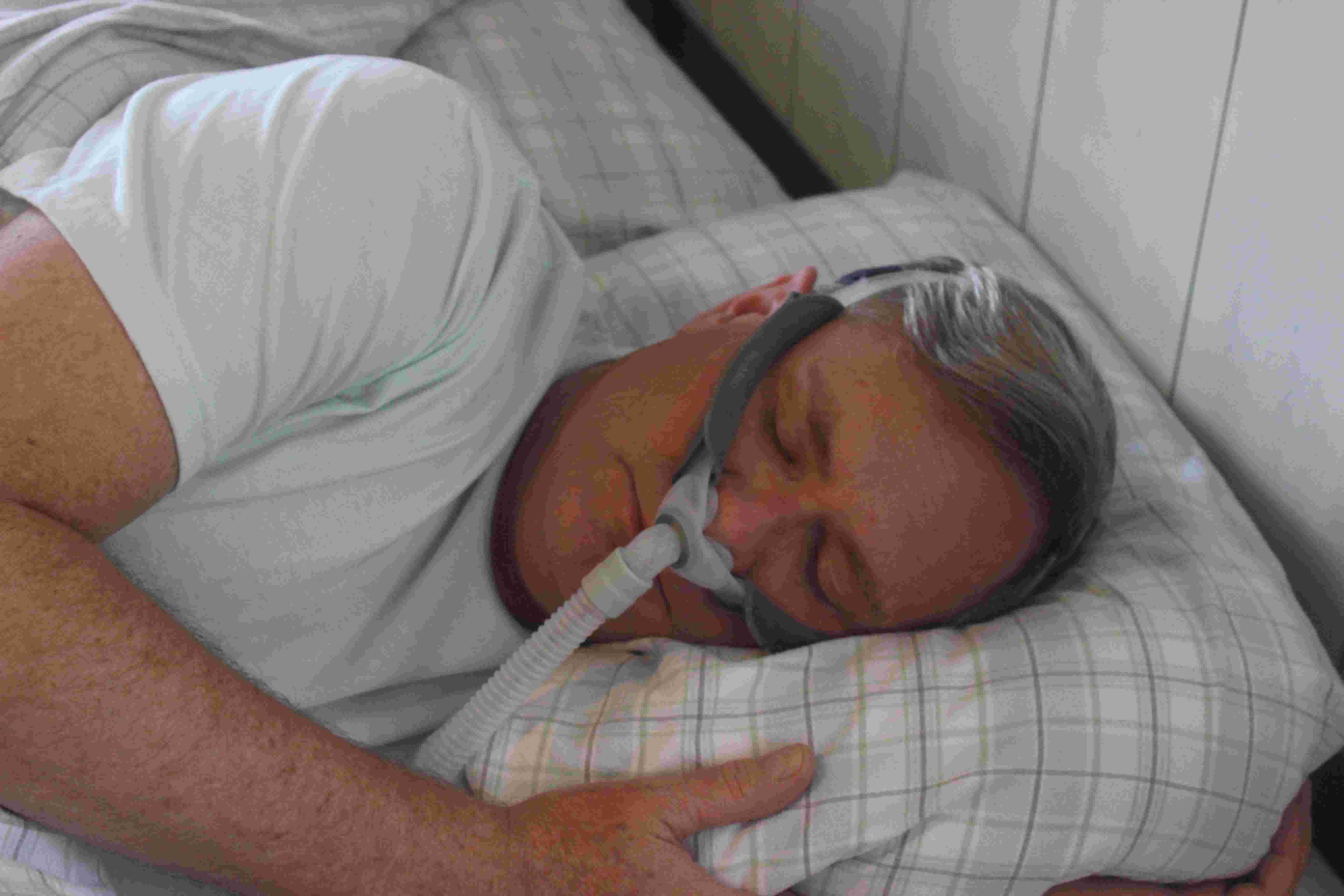 Patient struggling with traditional CPAP mask setup